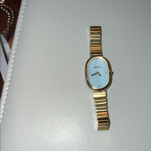 REVOLVE Accessories - Breda Watch in gold with Blue Face